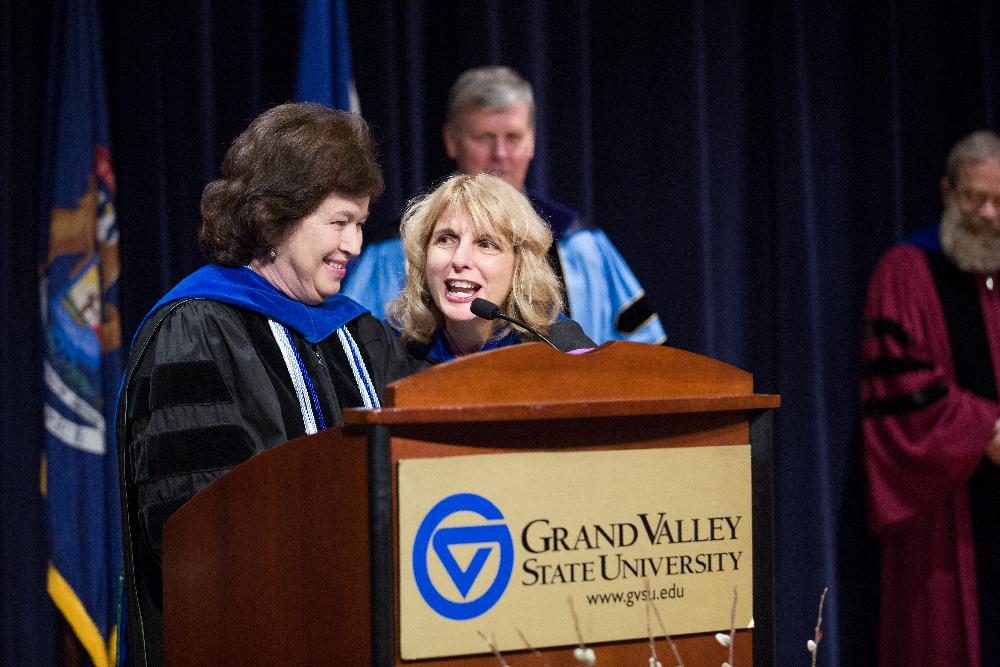 Gayle Davis and faculty member share the mic during the ceremony